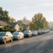 A quiet suburban Walnut Creek street with parked cars and single-story houses under warm fall light