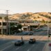 Office buildings and a surface parking lot near the Walnut Creek BART station on North California Boulevard in late afternoon light